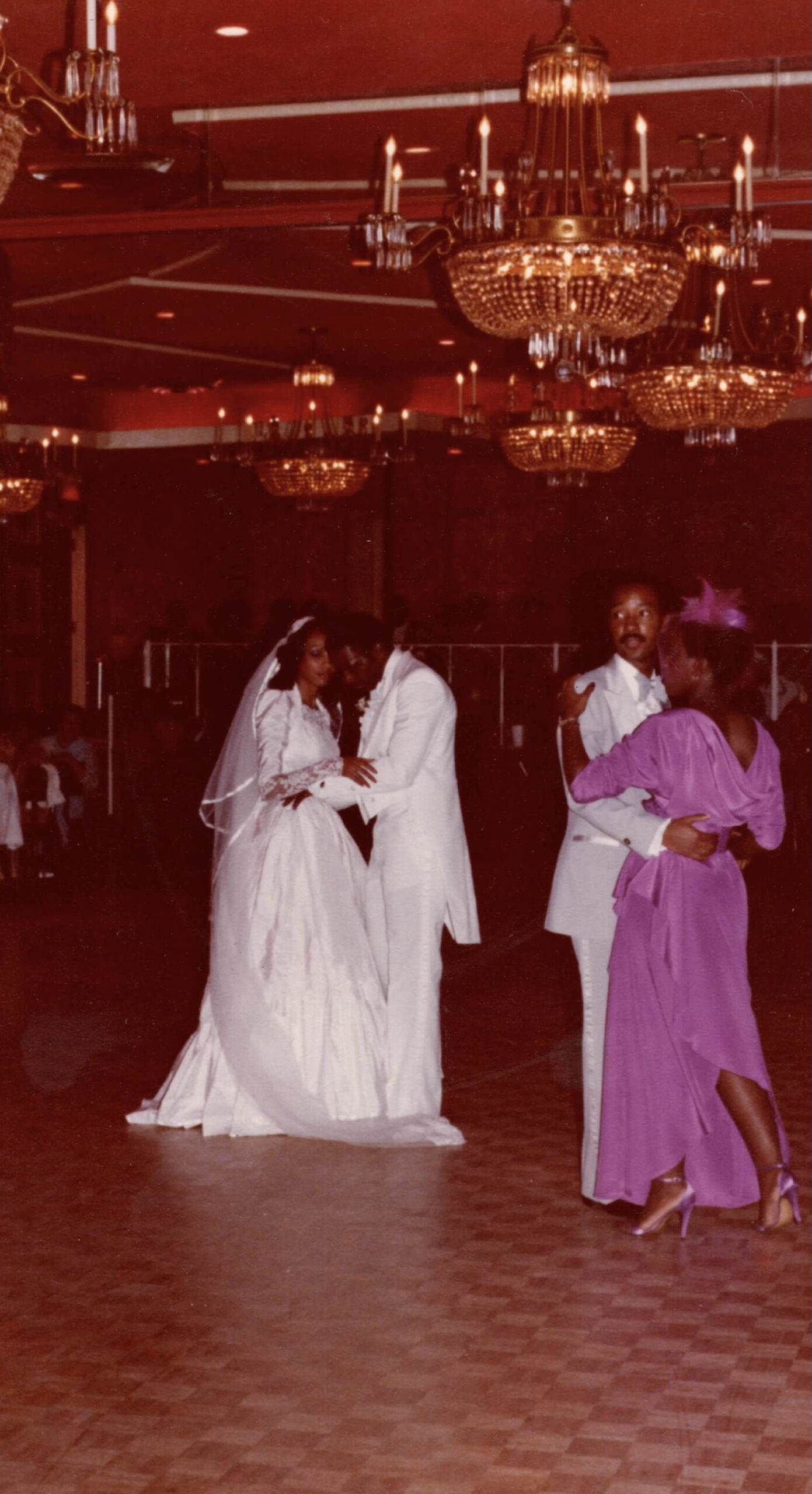 Vintage photograph of a wedding with bride and groom and a couple dancing