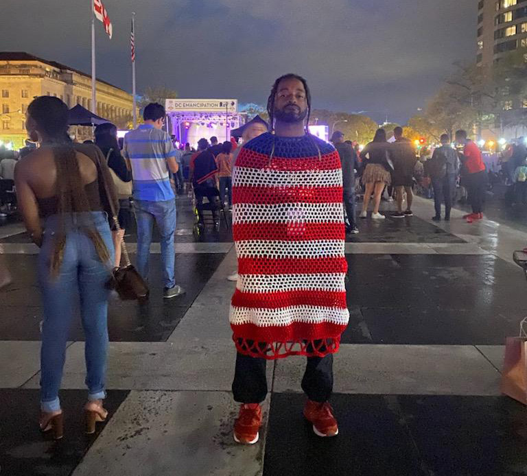 Dwayne Lawson-Brown in a red, white, and blue crochet cocoon