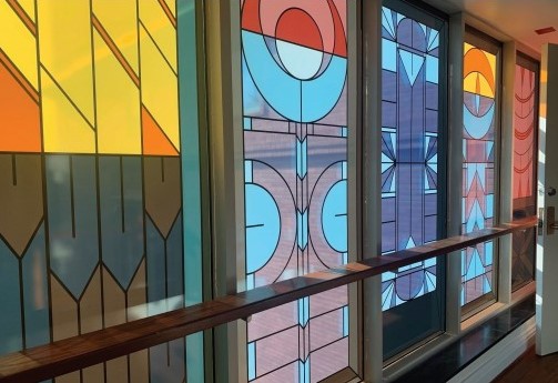 Colorful windows with different shapes in blue, yellow, and red.