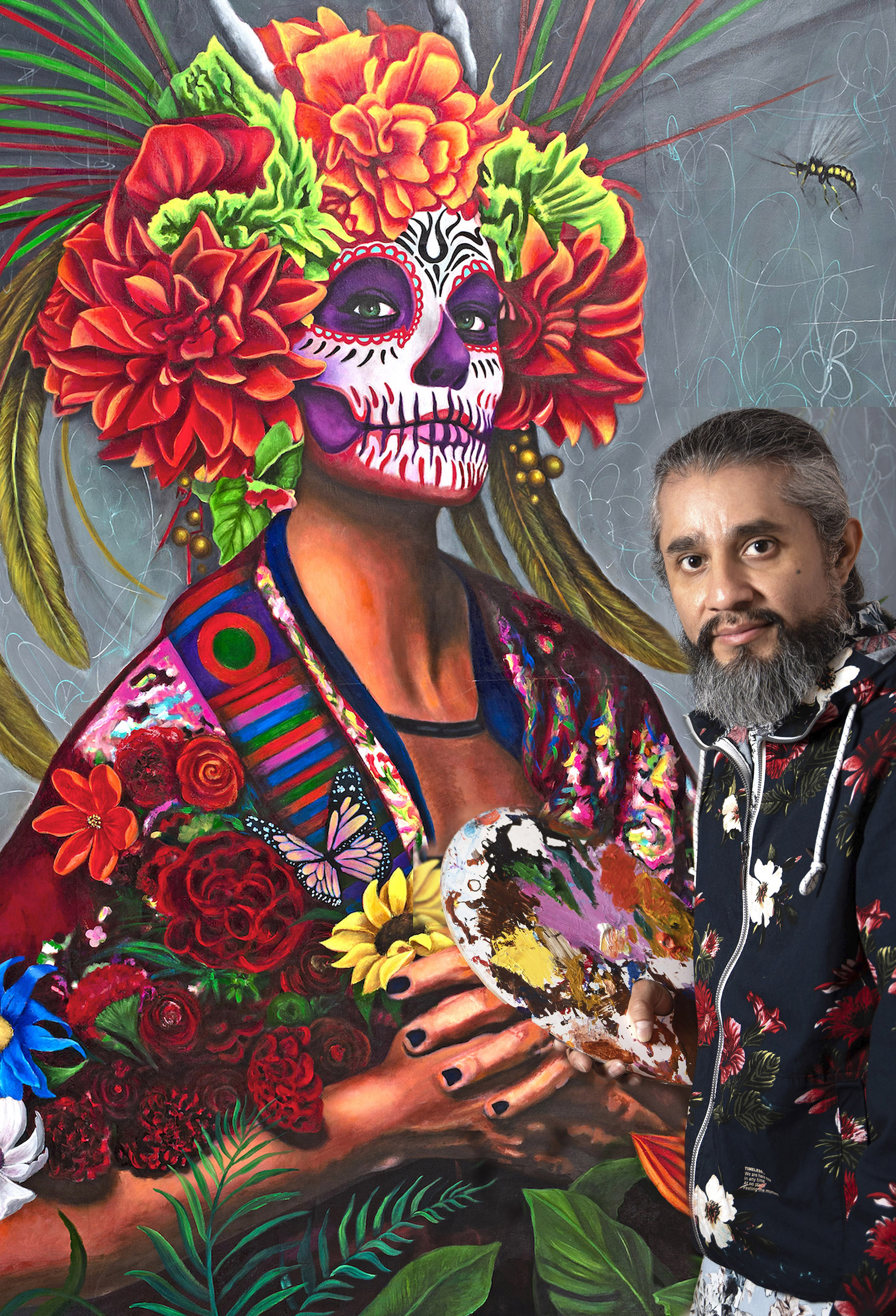 Luis Del Valle with his artwork