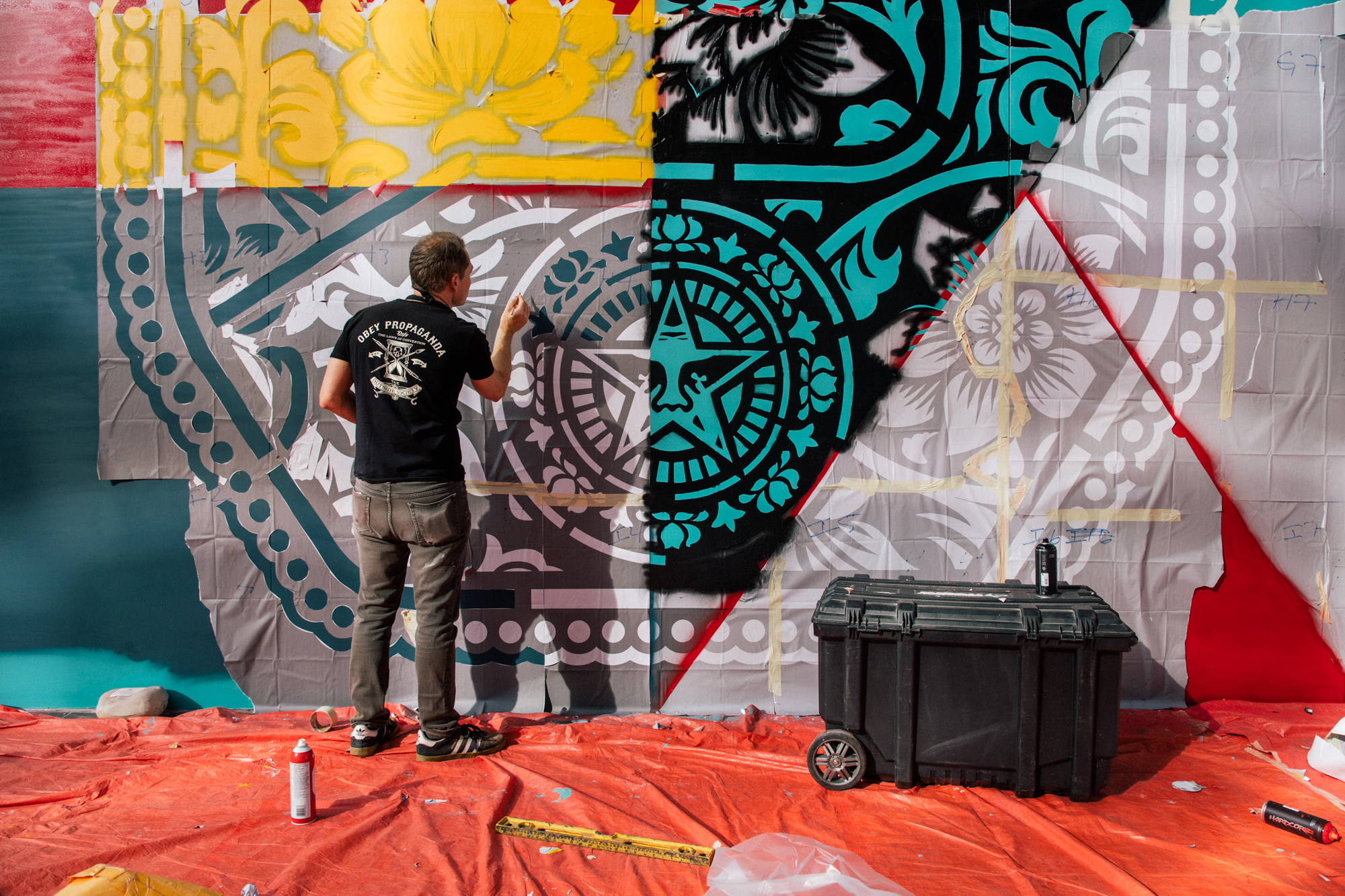 Shepard Fairey painting a mural