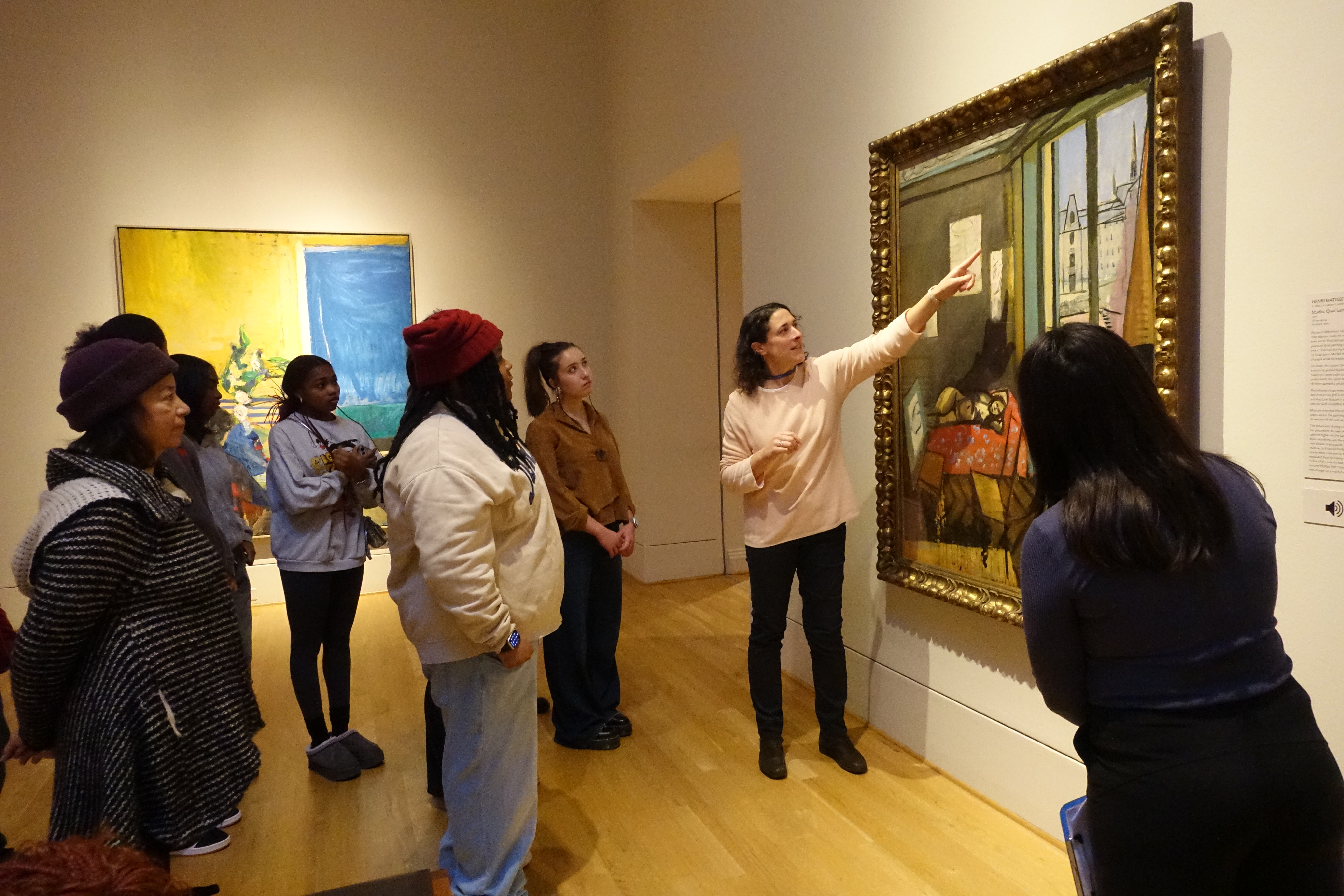 Patti giving a tour to high school students in the galleries