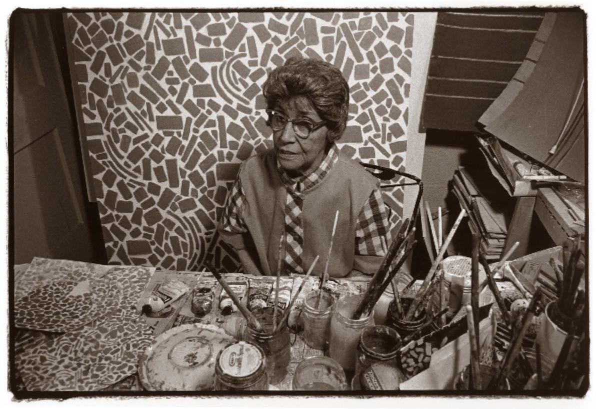 Black and white photograph of Alma Thomas in her studio by Frank Stewart