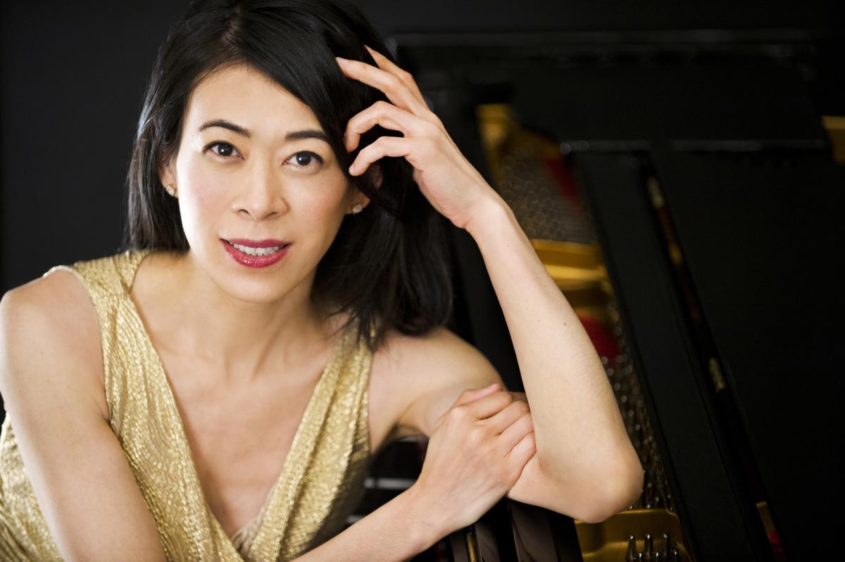 Jenny Lin, Photo: Liz Linder. A woman smiling and wearing a gold dress 