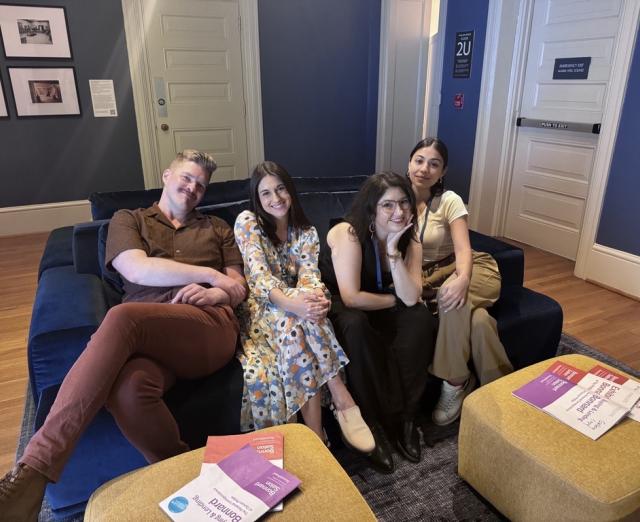 Photo of spring 2024 interns sitting together on blue couch