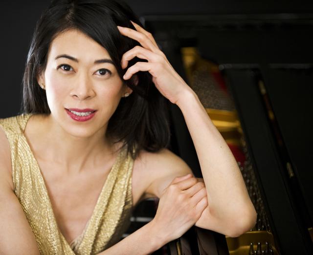 Jenny Lin, Photo: Liz Linder. A woman smiling and wearing a gold dress 