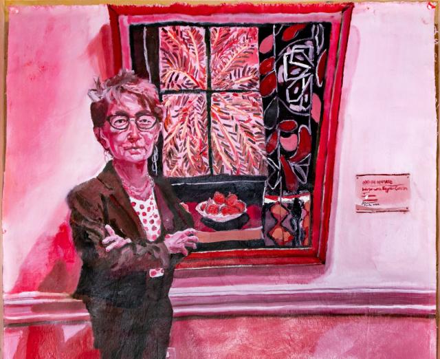 Painting in red of Dorothy Kosinski standing in front of a painting be Henri Matisse
