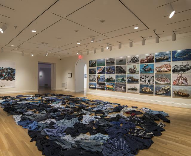 The Warmth of Other Suns installation view with Kader Attia, La Mer Morte (The Dead Sea), 2015, Floor installation of second-hand clothing