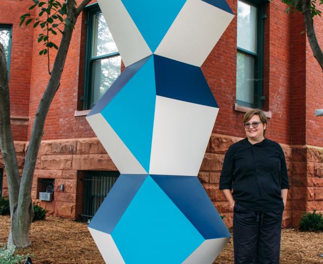 Angela Bulloch with her sculpture. Heavy Metal Stack: Fat Cyan Three, 2018