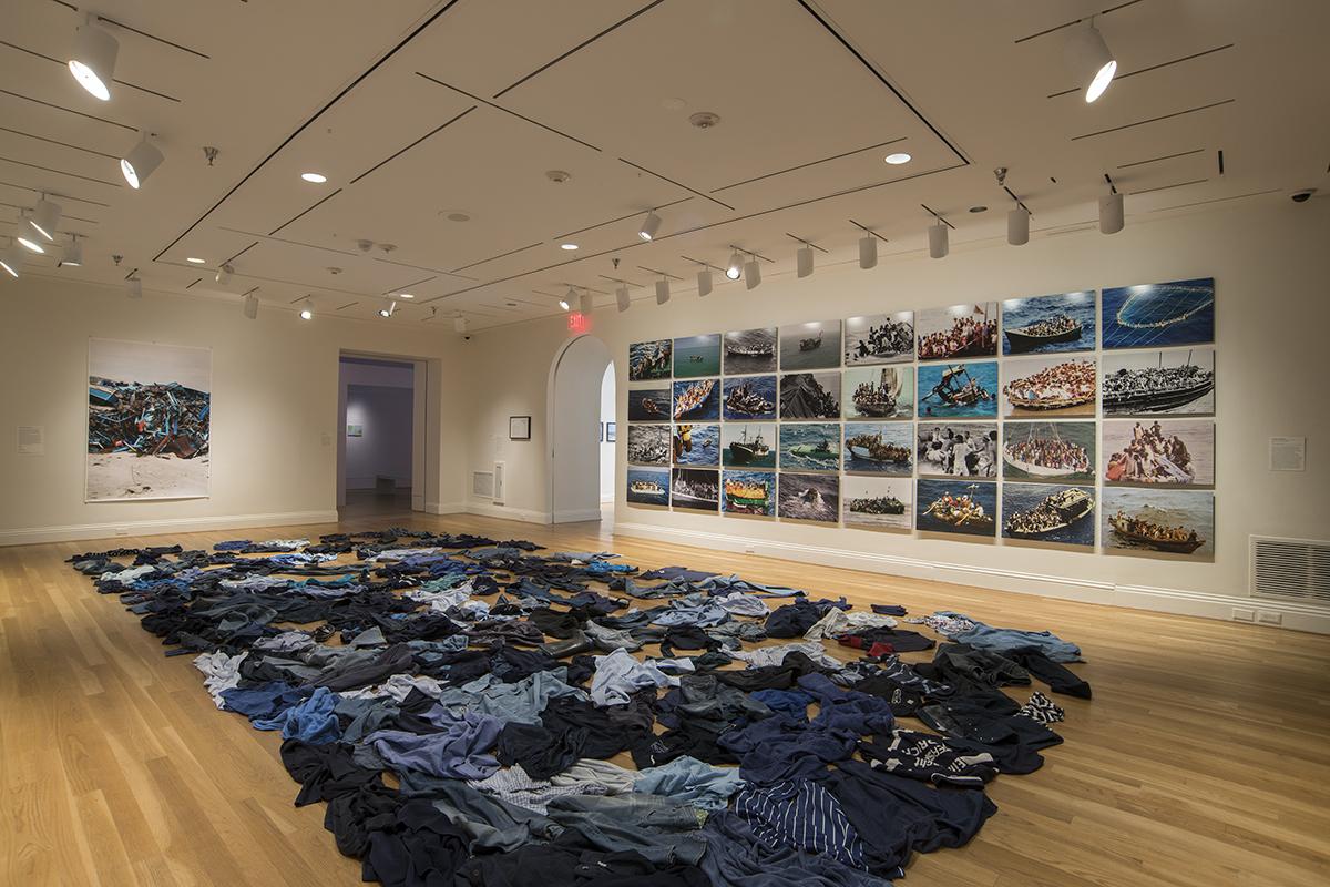 The Warmth of Other Suns installation view with Kader Attia, La Mer Morte (The Dead Sea), 2015, Floor installation of second-hand clothing