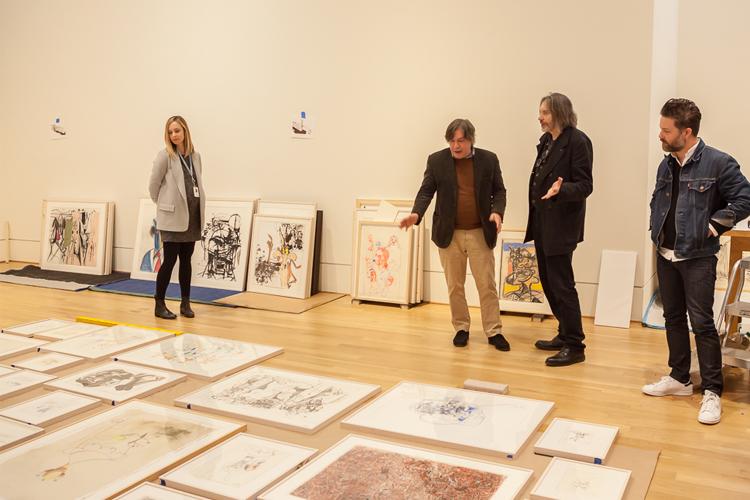 Finalizing layout plans. Left to right: Manager of Exhibitions Liza Strelka, contemporary artist George Condo, Exhibition Curator Klaus Ottmann, Condo studio assistant Benjamin Provo