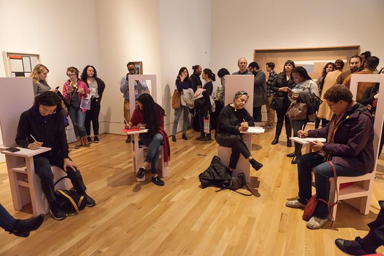 Visitors write letters for the To Future Women project at The Phillips Collection