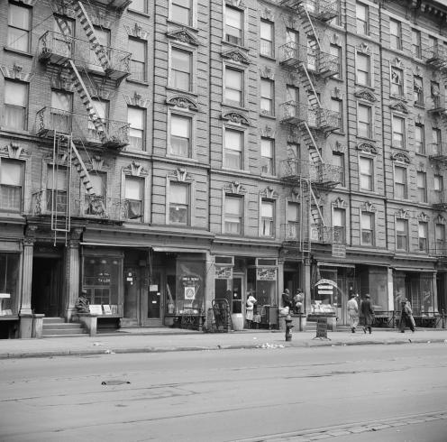 Black and white photograph of Harlem apartments from the 1940s