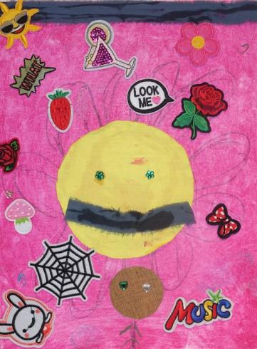 Pink painted canvas with a large smiley face and stickers.
