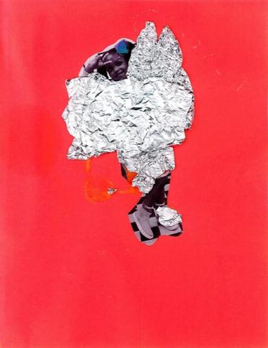 Red paper with a photo of a child and tin foil.