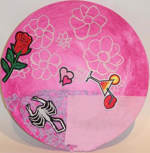 Circle canvas with flowers and stickers.