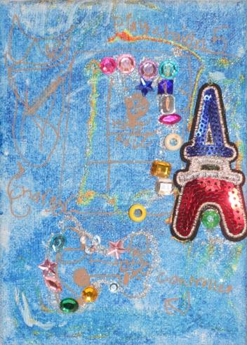 Blue painted canvas with gems and a red, blue Eiffel Tower.