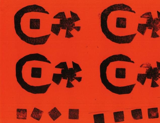 Pattern stamped on orange paper.